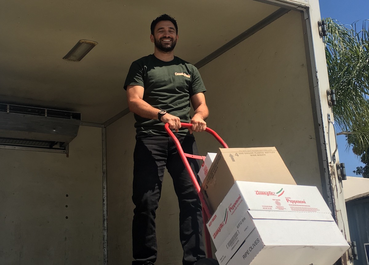 Cerenzia Foods service: man with a hand dolly